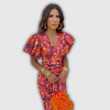 Vera | Vestido midi cruzado floral con mangas abullonadas